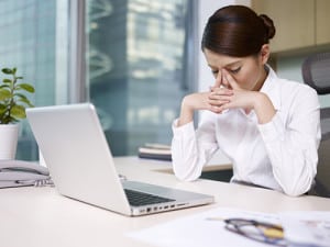Tired-woman-at-desk_opt