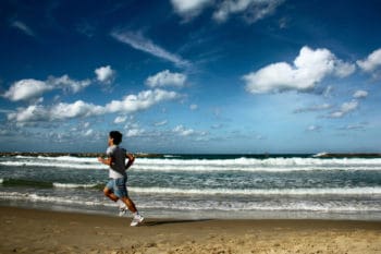 sportsman running on the beach in TelAviv