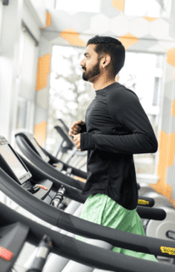 man running on treadmill for marathon training